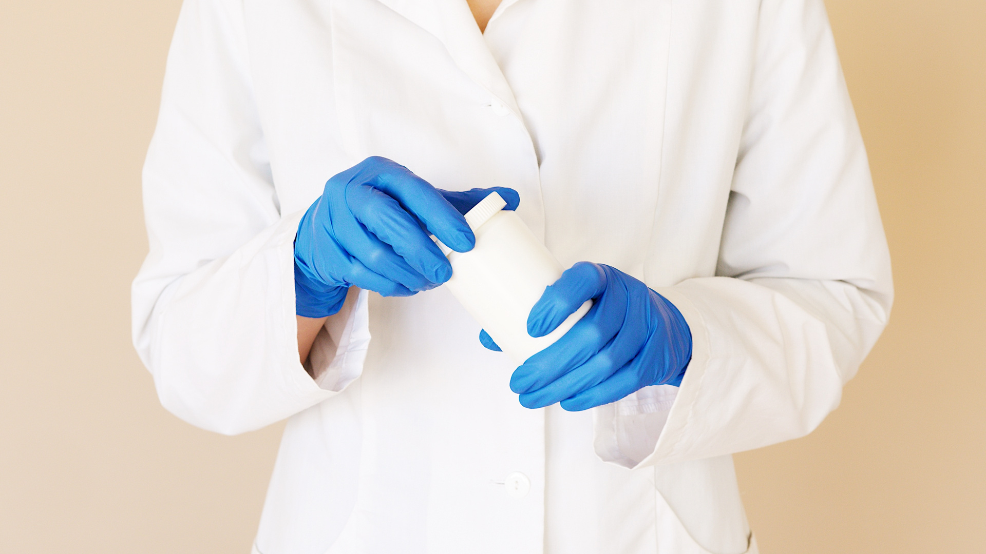 Crop doctor opening jar of pills